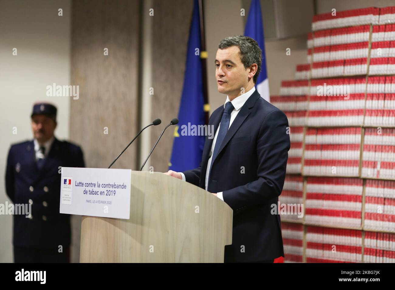 French Minister of Public Action and Accounts Gerald Darmanin (C) presents the 2019 results of the National plan to mobilise customs against the trafficking of tobacco and cigarettes at the Paris regional customs service on February 04, 2020, in front of cartons of illegal cigarettes. (Photo by Michel Stoupak/NurPhoto) Stock Photo