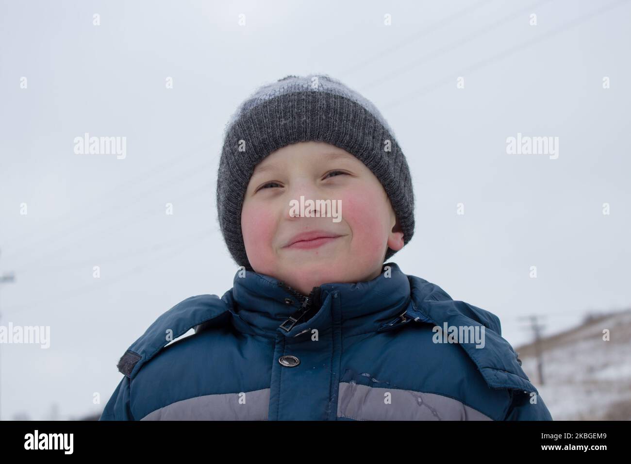 portrait of a little boy in winter clothes Stock Photo