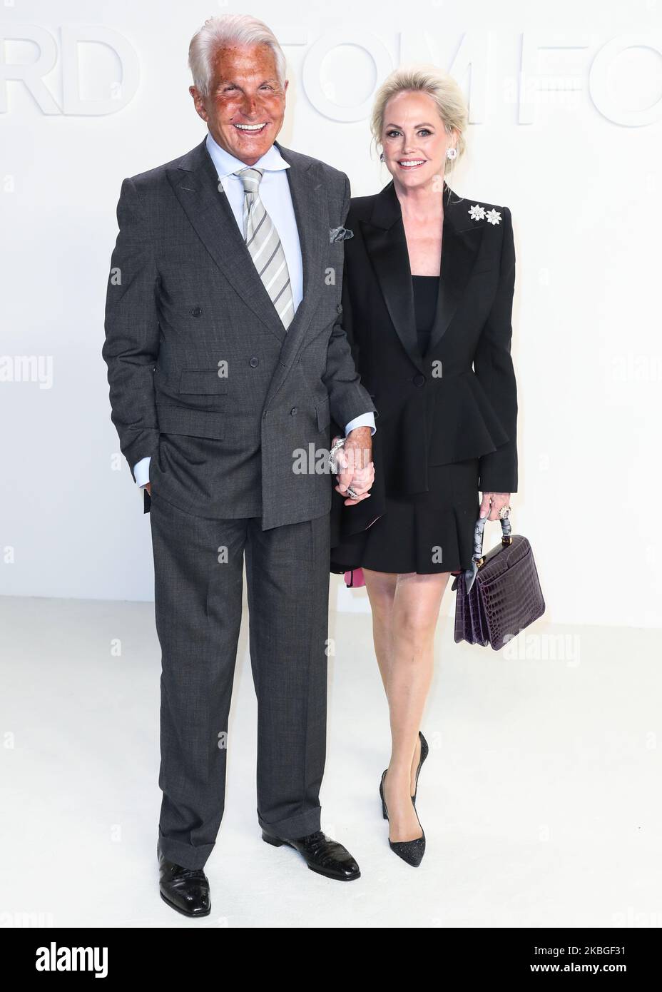 HOLLYWOOD, LOS ANGELES, CALIFORNIA, USA - FEBRUARY 07: George Hamilton and Barbara Sturm arrive at the Tom Ford: Autumn/Winter 2020 Fashion Show held at Milk Studios on February 7, 2020 in Hollywood, Los Angeles, California, United States. (Photo by Xavier Collin/Image Press Agency/NurPhoto) Stock Photo