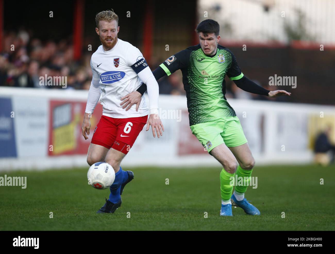 LR Dagenham & Redbridge's Kenny Clark and Liam McAlinden of Stockport