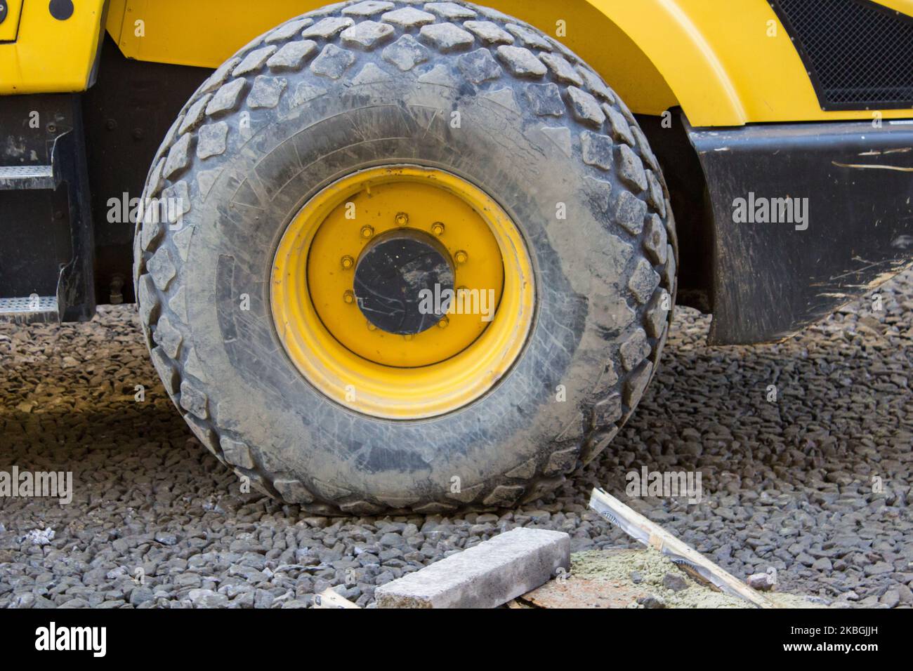 big truck wheel closeup object to rubble Stock Photo