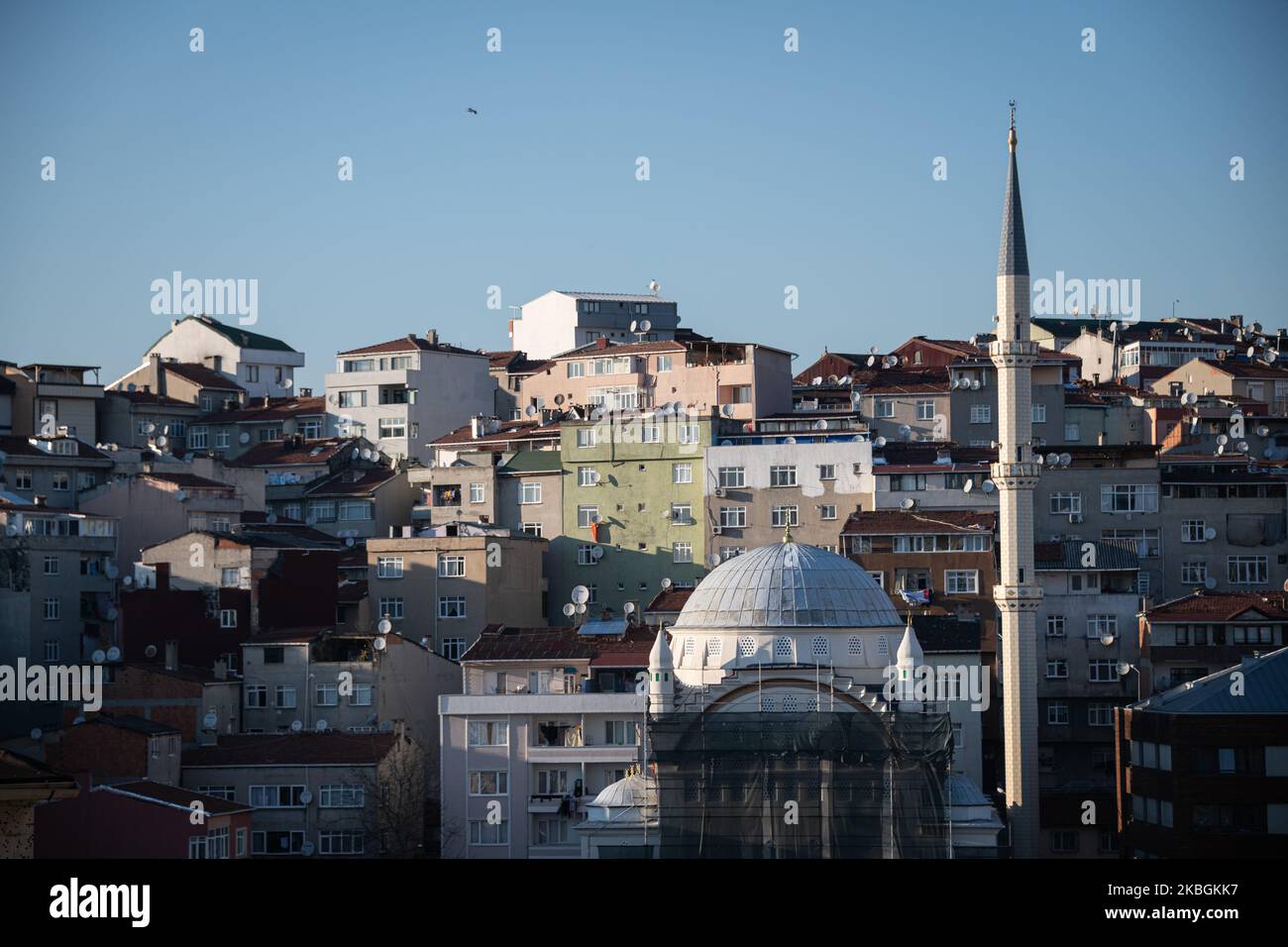 a newly built mosque rises over residential buildings in the Dolapdere neighborhood on February 2020 in Istanbul, Turkey. (Photo by Diego Cupolo/NurPhoto) Stock Photo