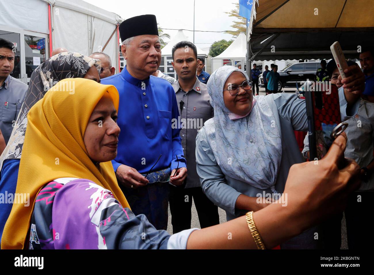 Supporters take selfies with Malaysian Caretaker Prime Minister Ismail Sabri Yaakob a day before the nomination day, in Bera, Pahang, Malaysia November 4, 2022. REUTERS/Lai Seng Sin Stock Photo