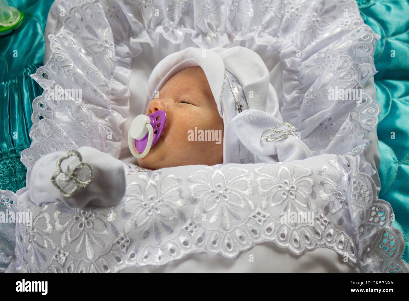 charming baby sleeps with a pacifier in his mouth Stock Photo Alamy