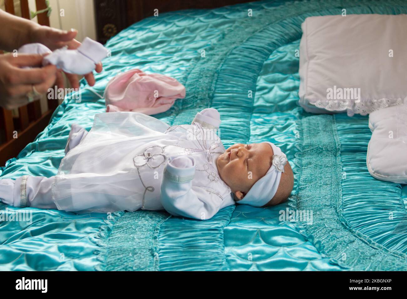 Girl Lying In Bed Baby In White Dress Stock Photo Alamy