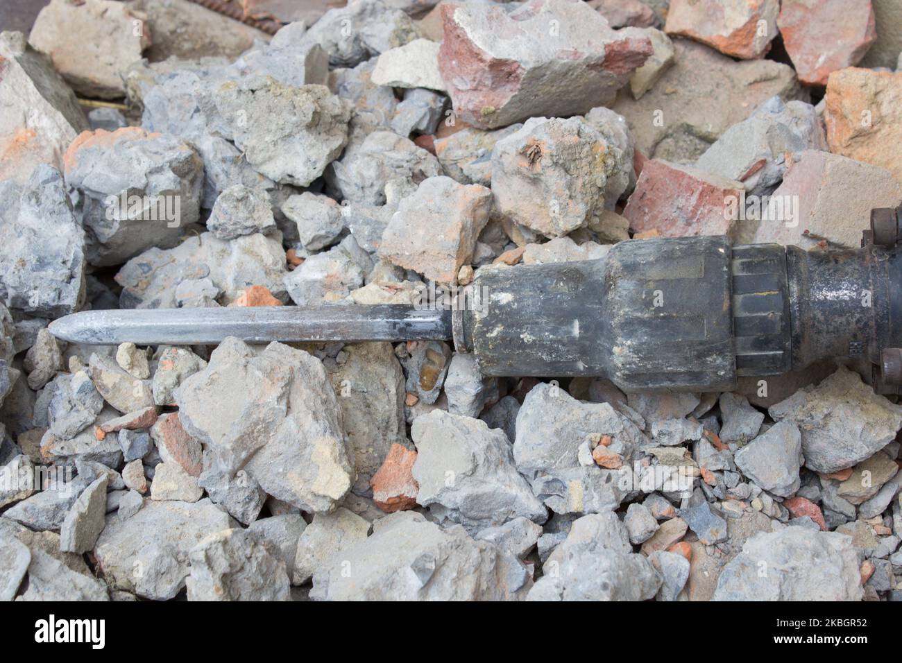 chisel Hammer on a pile of bricks lying Stock Photo Alamy