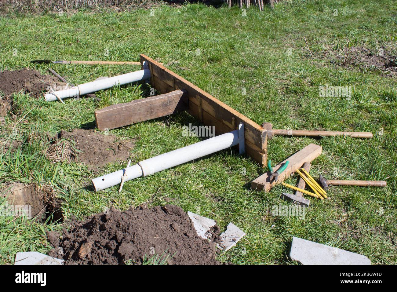 bench on the grass with carpentry tools Stock Photo