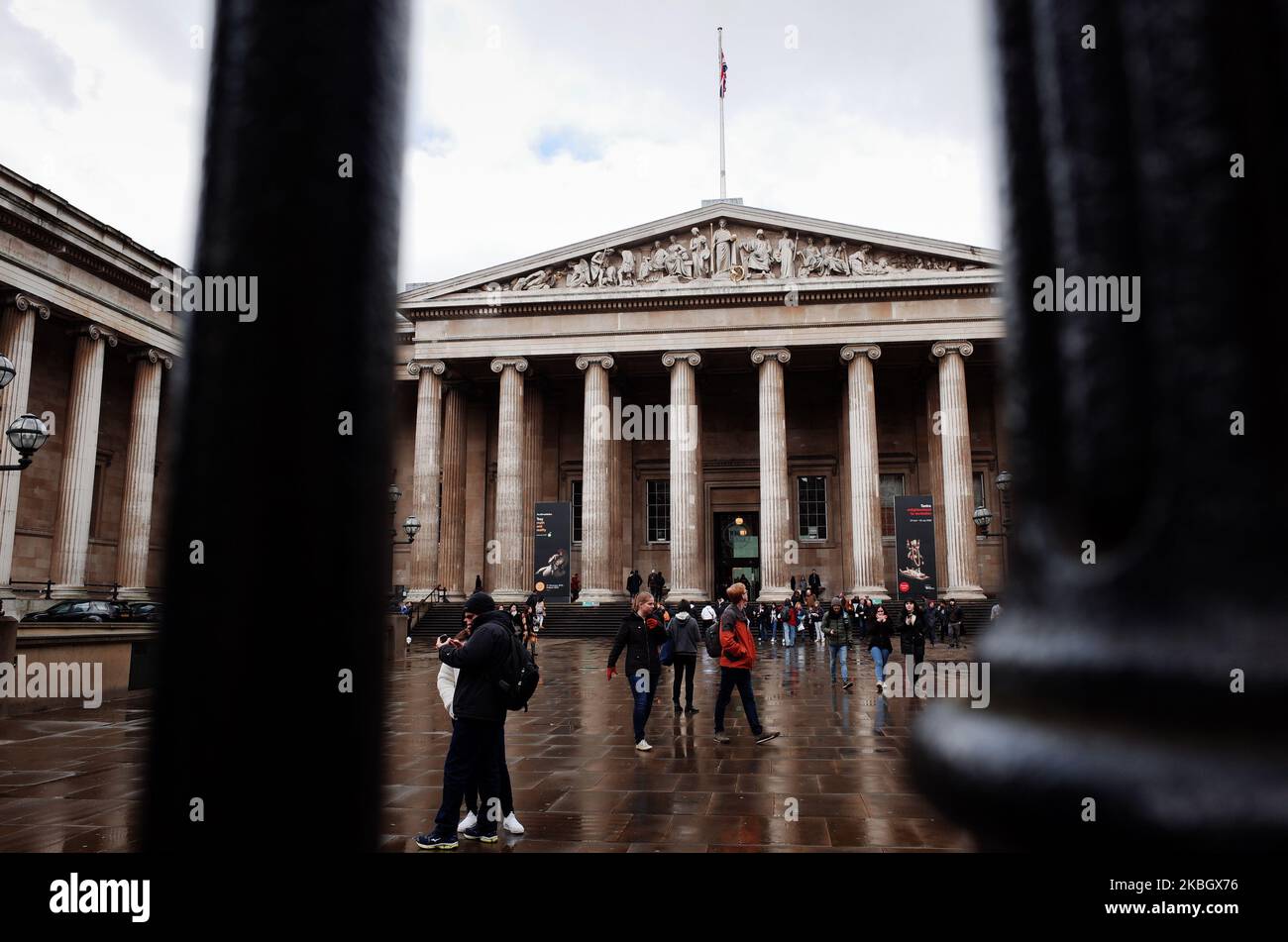 People walk in the forecourt of the British Museum in London, England, on February 13, 2020. The museum, one of London's top tourist attractions, is rarely far from controversy, from its long-running refusal to comply with Greek wishes for repatriation of the Parthenon Sculptures (otherwise known as the Parthenon or Elgin Marbles), to other debates on restitution over artifacts including the Rosetta Stone (taken from Egypt) and Benin bronzes (taken from what is now Nigeria), to more recent pressure from climate activists over the institution's sponsorship ties to oil giant BP. (Photo by David  Stock Photo