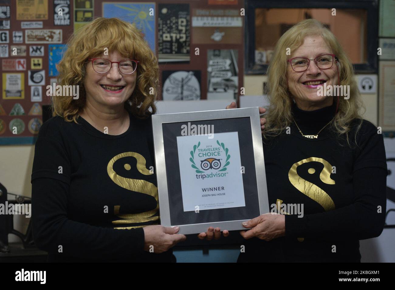 Hadasa Bau (R) and Clila Bau-Cohen (L) with the Trip Advisor 2018 Winner Award for the best museum, inside 'Joseph Bau house' Museum in Tel Aviv. Joseph Bau was a Polish-Israeli artist, philosopher, inventor, animator, comedian, commercial creator, copy-writer, photographer and poet. He trained as a graphic artist at the Jan Matejko Academy of Fine Arts in Krakow. During WW2 he was transferred to the Plaszow concentration camp, where he met and secretly married Rebecca Tennenbaum. Their story inspired Steven Spielberg and their wedding is shown in Spielberg movie 'Schindler's List'. Later, Jos Stock Photo