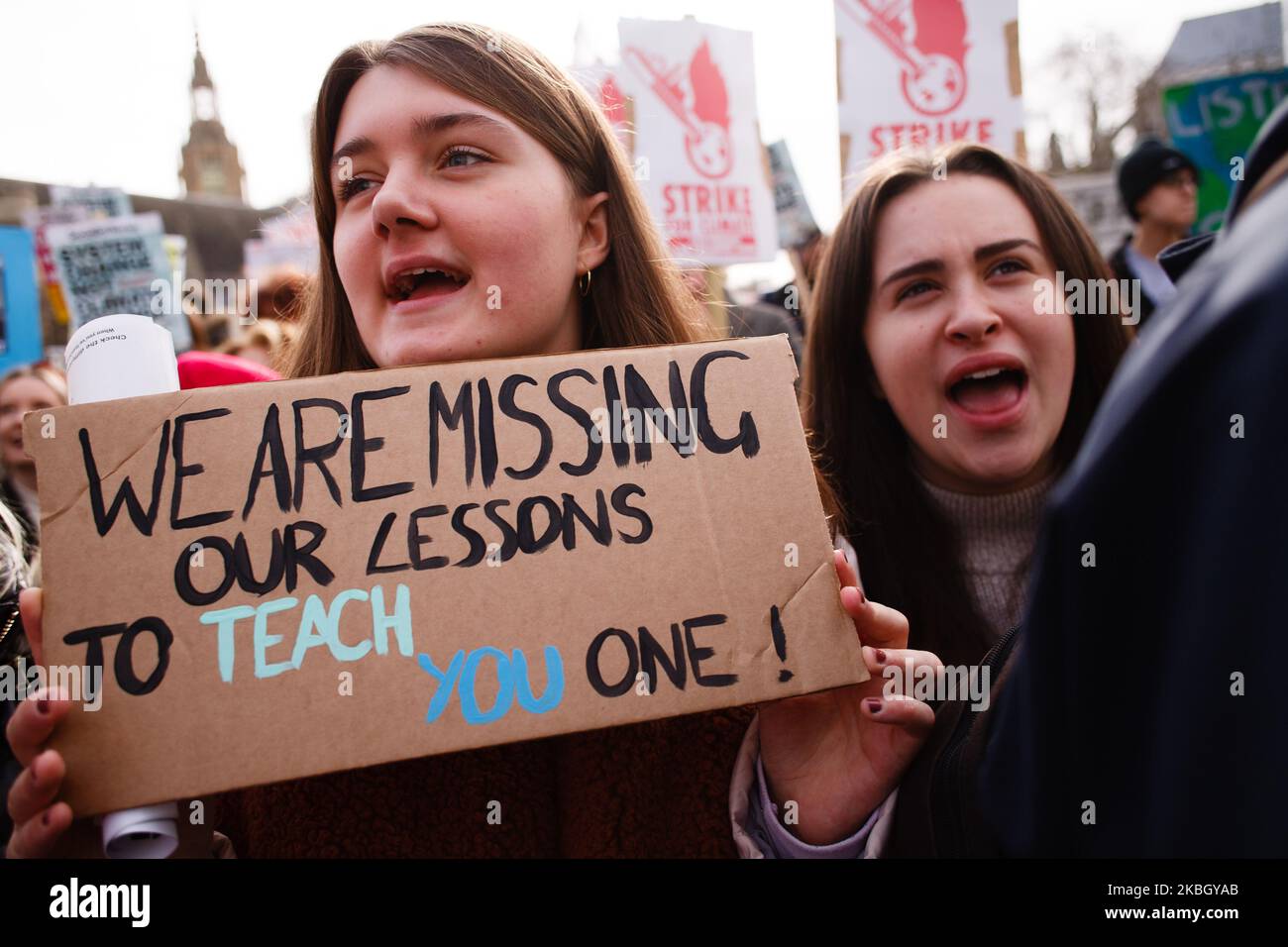 Young environmentalists take part in a 'climate strike' demonstration organised by the youth-led 'Fridays For Future' activist movement in Parliament Square in London, England, on February 14, 2020. The event marks one year since the first global wave of climate strike protests brought hundreds of thousands of schoolchildren onto the streets in cities around the world to call for greater action from governments to tackle the climate crisis. Several such coordinated global events have since been held, with worldwide climate activism over the past year further bolstered by the tandem growth of t Stock Photo