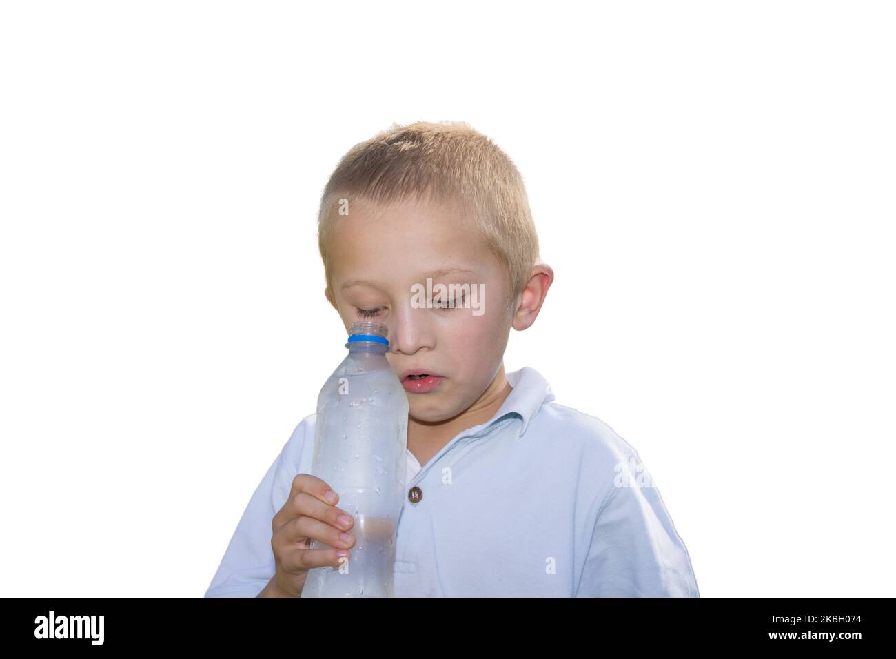 holding a water bottle and a look inside the bottle boy Stock Photo Alamy
