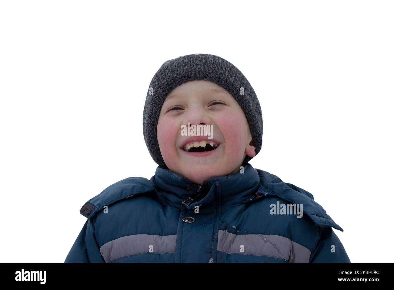boy laughing on white background winter clothes Stock Photo