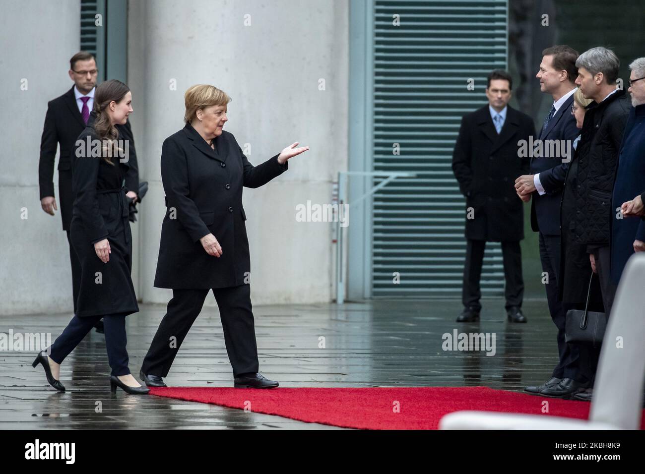 German Chancellor Angela Merkel (C) receives new Finnish Prime Minister Sanna Marin (2L) with military honours at the Chancellery in Berlin on February 19, 2020. (Photo by Emmanuele Contini/NurPhoto) Stock Photo