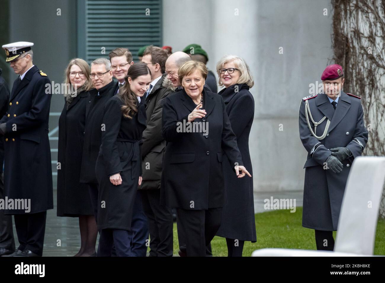 German Chancellor Angela Merkel (C-R) and new Finnish Prime Minister Sanna Marin (C-L) arrive to listen to the national anthems at the Chancellery in Berlin on February 19, 2020. (Photo by Emmanuele Contini/NurPhoto) Stock Photo