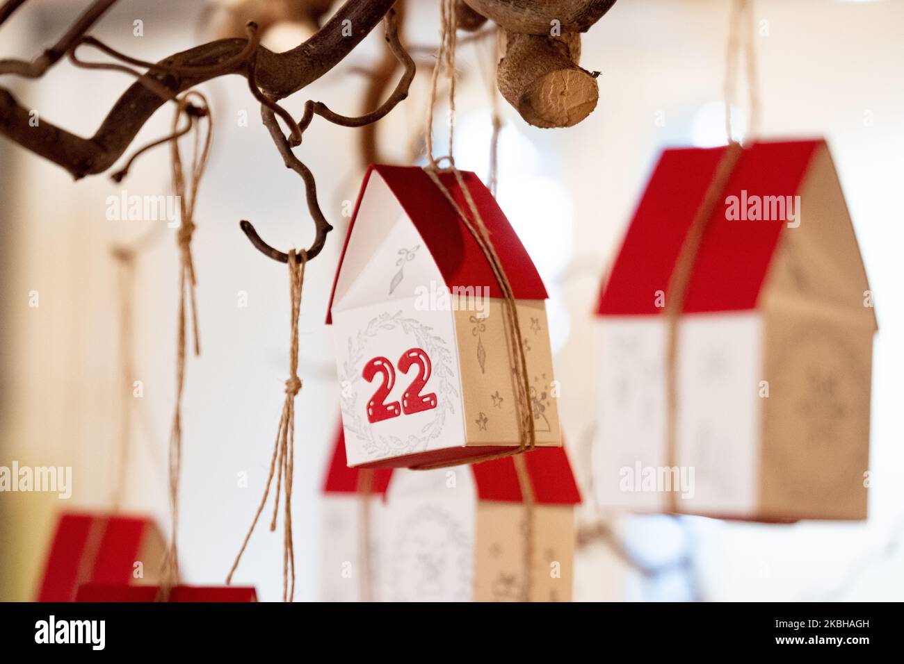 Advent calendar consisting of handmade little houses with the 22 in