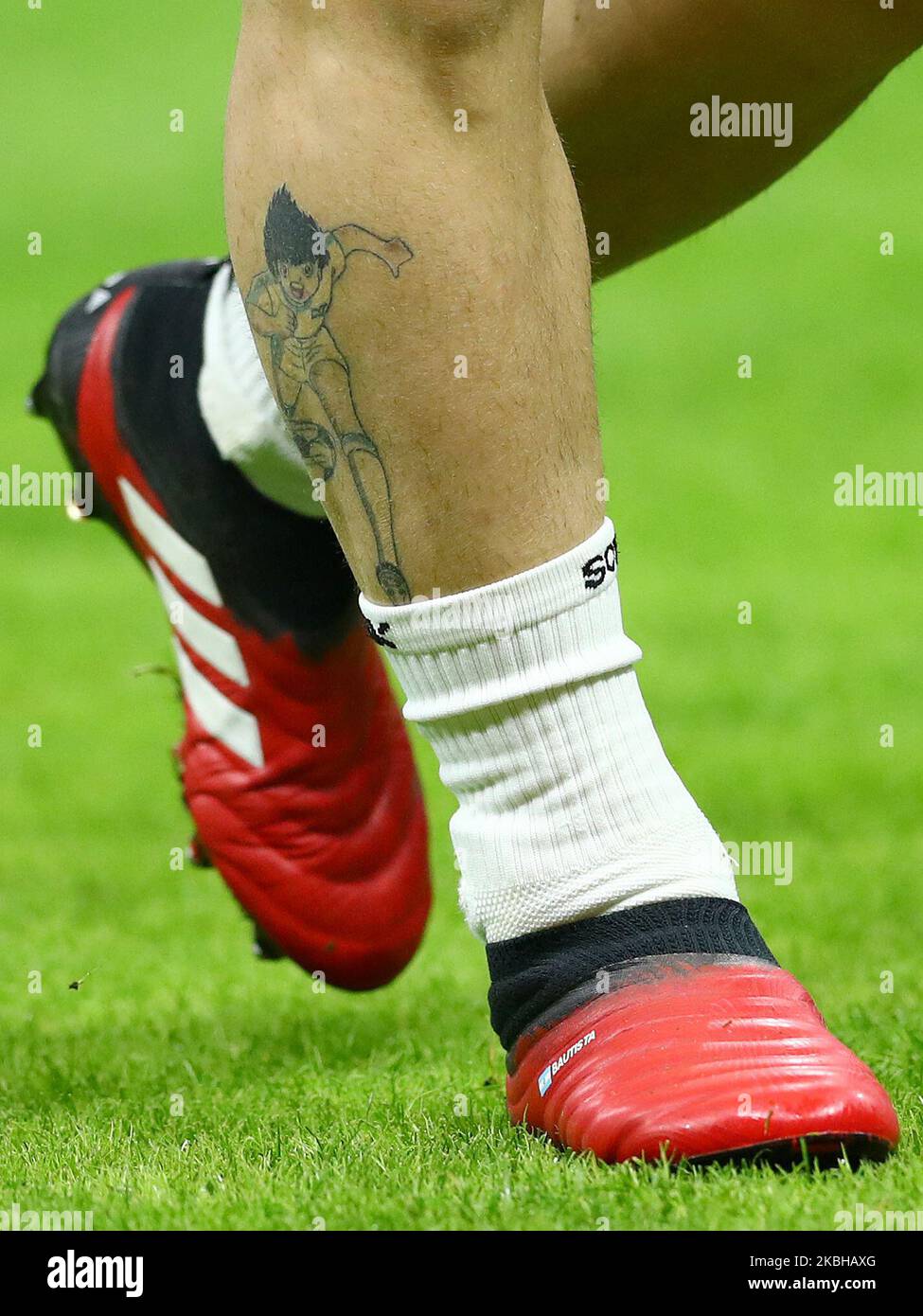 The costumised shoes of Alejandro Gomez of Atalanta in honour of his son and his Holly and Benji cartoon tattoo on the right calf during the UEFA Champions League Round of 16 first leg match Atalanta BC v Valencia Cf at the San Siro Stadium in Milan, Italy on February 19, 2020 (Photo by Matteo Ciambelli/NurPhoto) Stock Photo