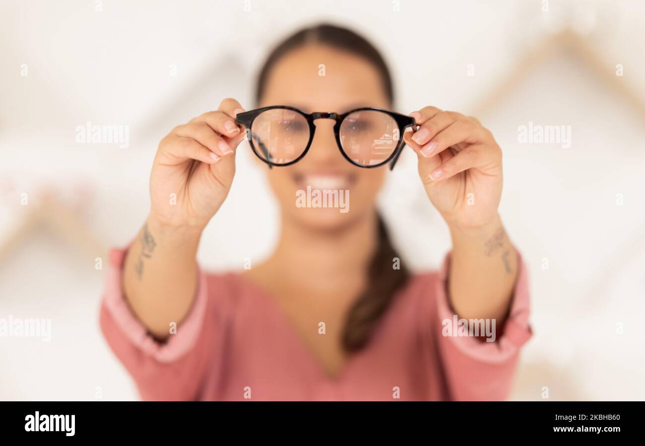 Vision, eyesight and woman with glasses in hands for eye test, holding