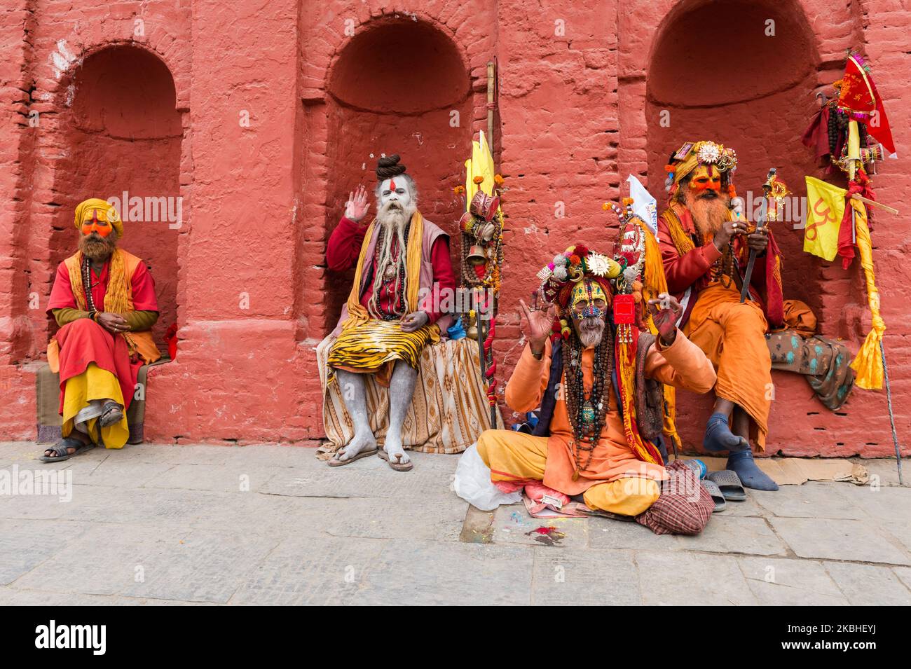 Hindu holy men (sadhus) with painted faces and dressed in colouful clothing and elaborate headpieces gather at the Pashupatinath temple complex, one of the holiest shrines of the Hindus as well as UNESCO Heritage Site, on the day of Maha Shivaratri Festival on 21 February, 2020 in Kathmandu, Nepal. Hundreds of thousands of devotees from across Nepal and India are expected to visit the Pashupatinath Temple to celebrate Maha Shivaratri by offering special prayers and fasting to worship Lord Shiva. (Photo by WIktor Szymanowicz/NurPhoto) Stock Photo
