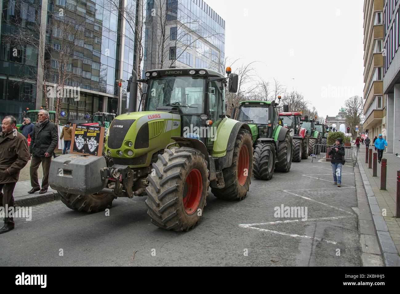 Farmers and European milk producers gather during a rally with the support of 150 tractors, they protest in front of the EU Headquarters around Schumanplein ahead and during of a special European Council summit, meeting of EU leaders on February 20, 2020 in Brussels, Belgium. The demonstration of the farmers in the capital of Belgium, Brussels is supported by the Wallon agricultural federation FWA, the Federation des Jeunes Agriculteurs and also the Flemish delegations of the Boerenbond, the General Farmer's Syndicate ABS and the young farmers of the Groene Kring. Farmers don't agree on the ne Stock Photo