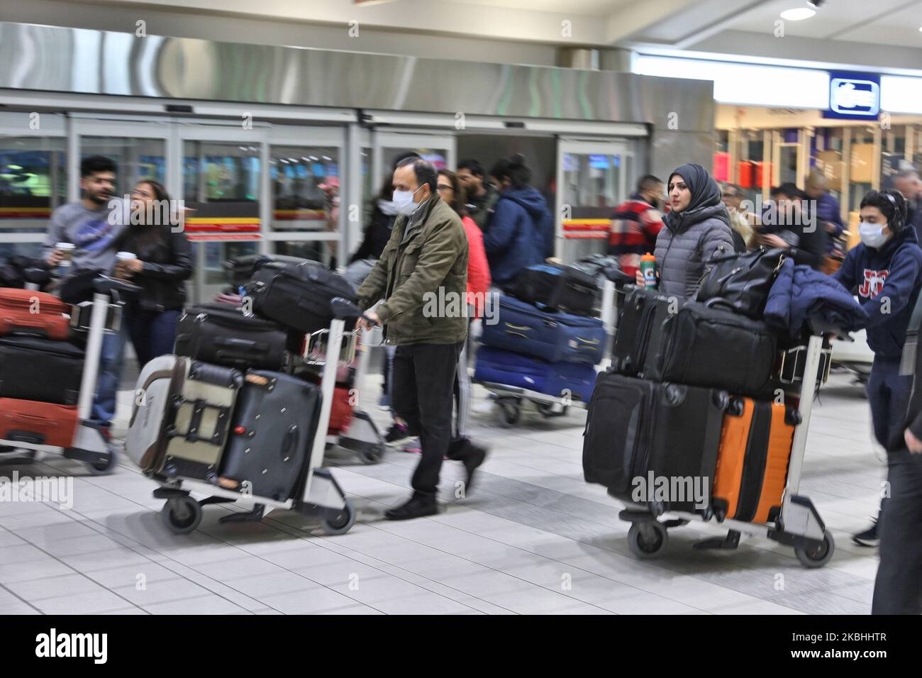 Passengers at Pearson International Airport in Ontario, Canada. Some passangers are wearing masks to protect from the novel coronavirus (COVID-19). Pearson International Airport is Canada's largest and busiest airport. (Photo by Creative Touch Imaging Ltd./NurPhoto) Stock Photo