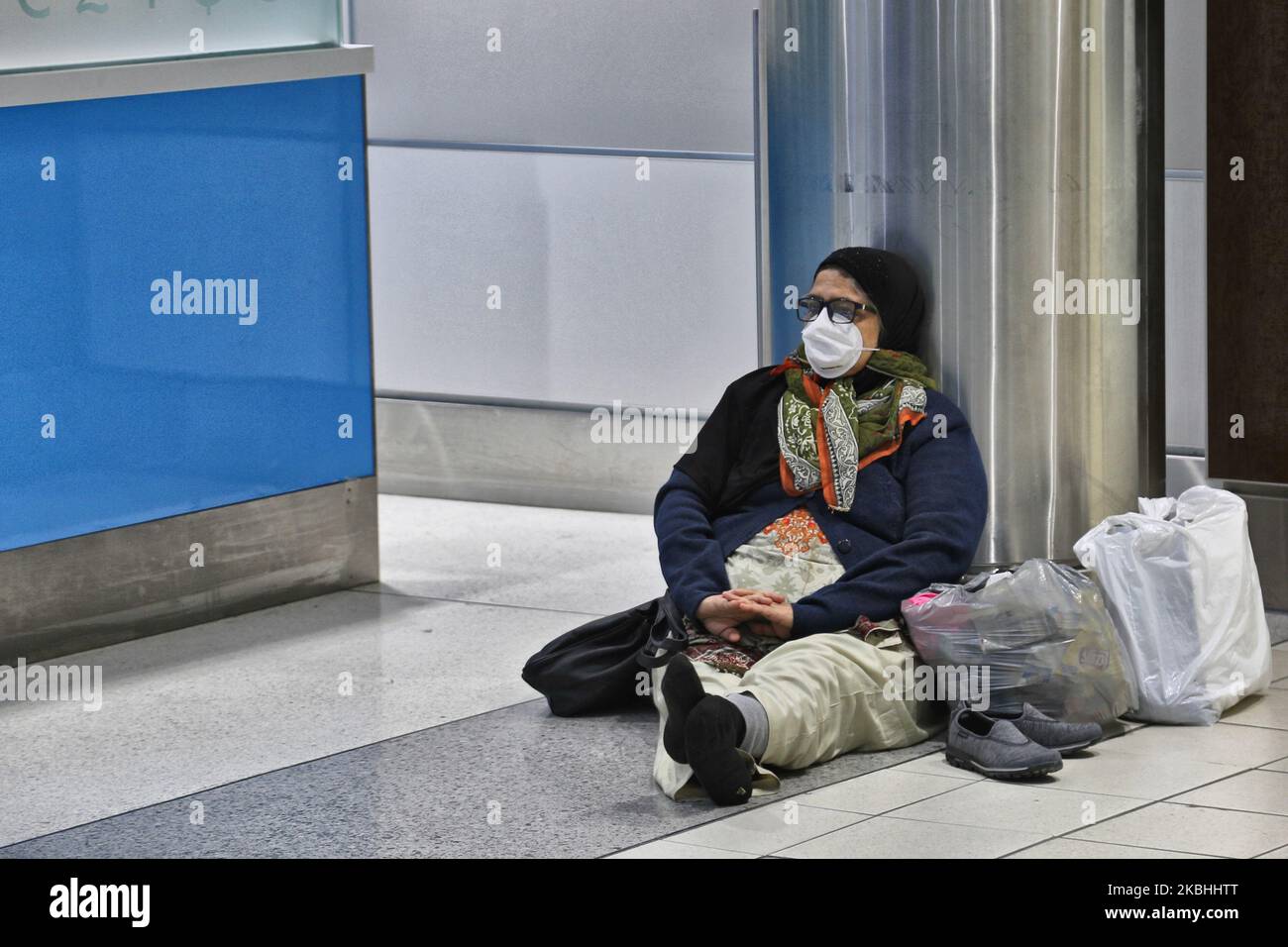Elderly woman wearing a mask to protect her from the novel coronavirus (COVID-19) while waiting for her flight at Pearson International Airport in Ontario, Canada. Pearson International Airport is Canada's largest and busiest airport. (Photo by Creative Touch Imaging Ltd./NurPhoto) Stock Photo