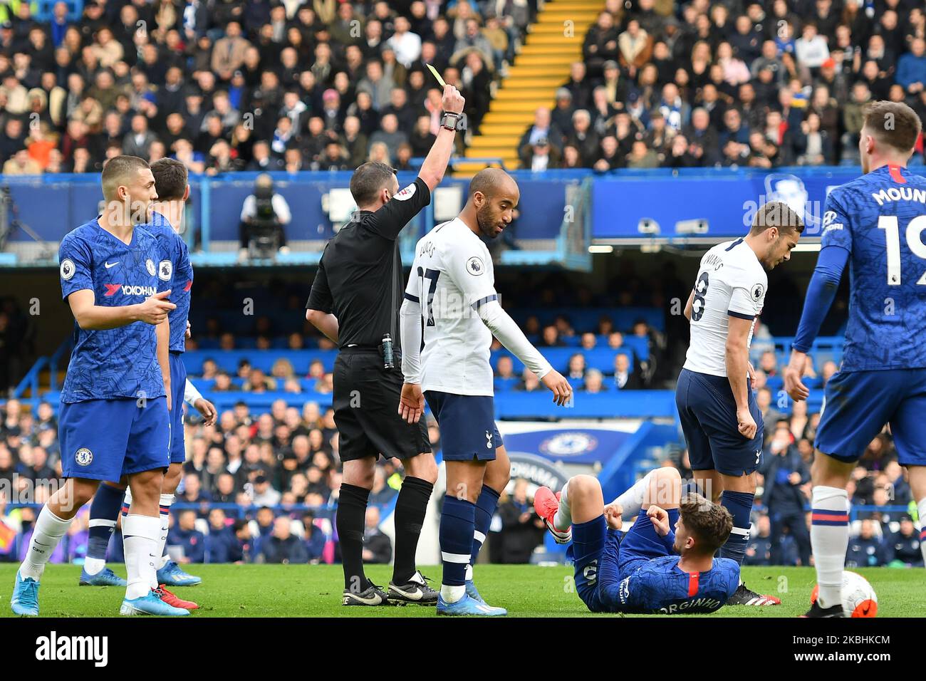 Harry Winks of Tottenham is shown a yellow card by the referee Michael Oliver during the Premier League match between Chelsea and Tottenham Hotspur at Stamford Bridge, London on Saturday 22nd February 2020. (Photo by Ivan Yordanov/MI News/NurPhoto) Stock Photo