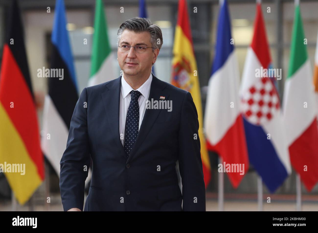 Prime Minister of Croatia Andrej Plenkovic as seen arriving on the red carpet with EU flags at forum Europa building. The Croatian PM is having a doorstep press and media briefing during the second day of the special European Council, EURO leaders summit - meeting about for the negotiations of the future planning of the next long term budget, financial framework of the European Union for 2021-2027. Brussels, Belgium, February 21, 2020 (Photo by Nicolas Economou/NurPhoto) Stock Photo