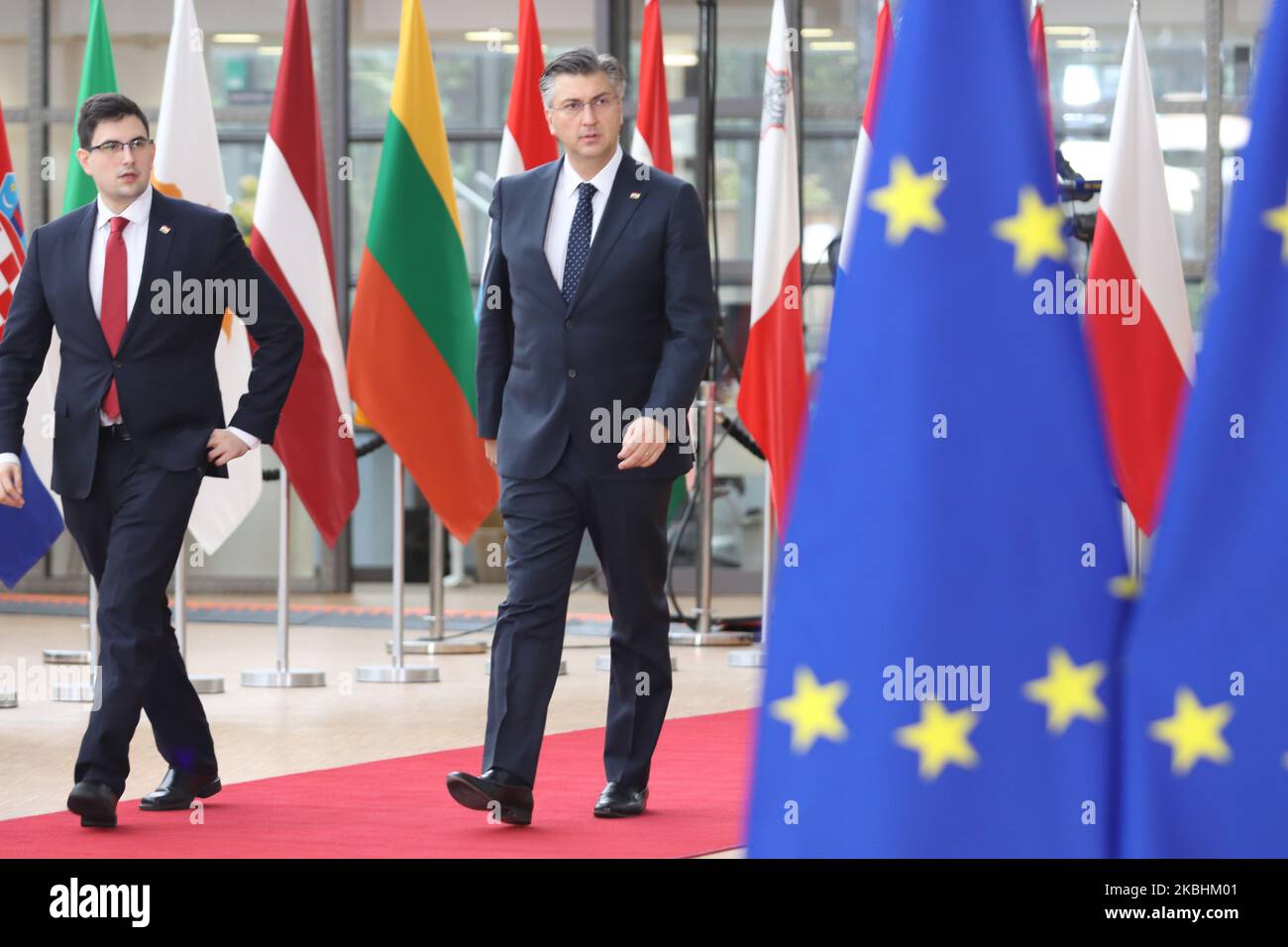 Prime Minister of Croatia Andrej Plenkovic as seen arriving on the red carpet with EU flags at forum Europa building. The Croatian PM is having a doorstep press and media briefing during the second day of the special European Council, EURO leaders summit - meeting about for the negotiations of the future planning of the next long term budget, financial framework of the European Union for 2021-2027. Brussels, Belgium, February 21, 2020 (Photo by Nicolas Economou/NurPhoto) Stock Photo