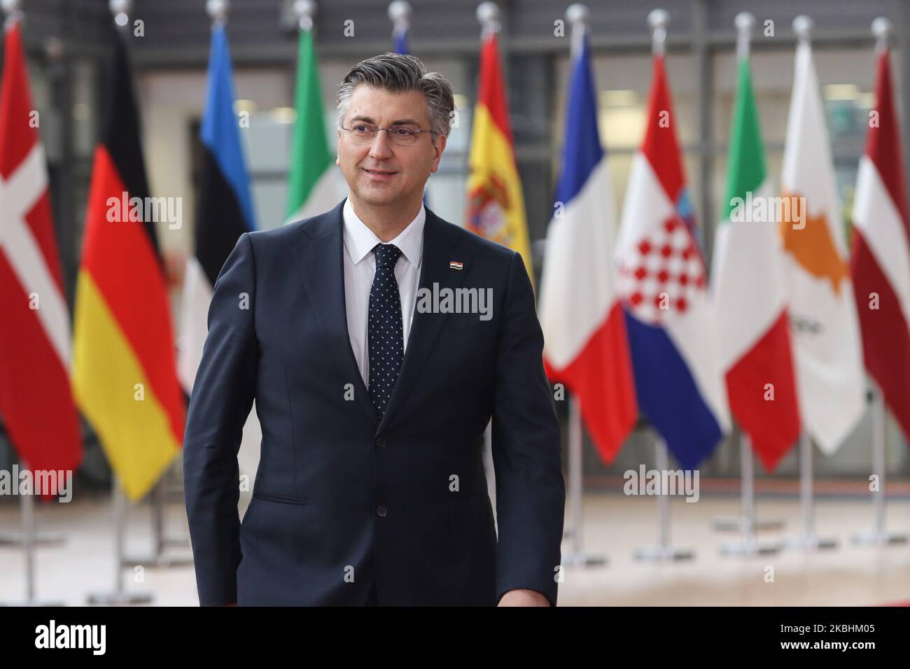 Prime Minister of Croatia Andrej Plenkovic as seen arriving on the red carpet with EU flags at forum Europa building. The Croatian PM is having a doorstep press and media briefing during the second day of the special European Council, EURO leaders summit - meeting about for the negotiations of the future planning of the next long term budget, financial framework of the European Union for 2021-2027. Brussels, Belgium, February 21, 2020 (Photo by Nicolas Economou/NurPhoto) Stock Photo