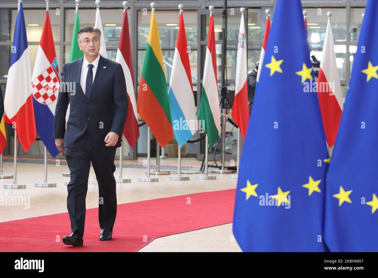 Prime Minister of Croatia Andrej Plenkovic as seen arriving on the red carpet with EU flags at forum Europa building. The Croatian PM is having a doorstep press and media briefing during the second day of the special European Council, EURO leaders summit - meeting about for the negotiations of the future planning of the next long term budget, financial framework of the European Union for 2021-2027. Brussels, Belgium, February 21, 2020 (Photo by Nicolas Economou/NurPhoto) Stock Photo