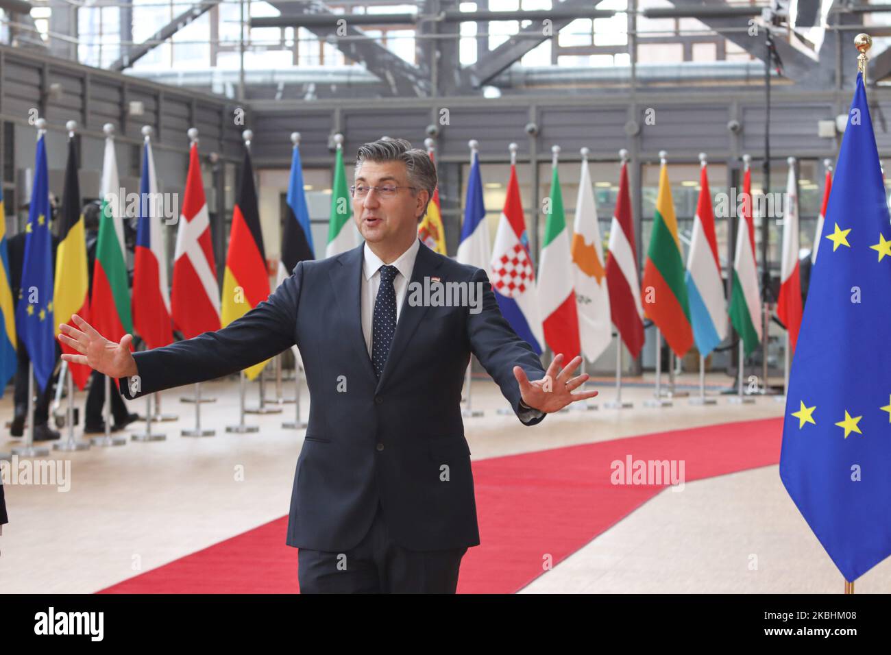 Prime Minister of Croatia Andrej Plenkovic as seen arriving on the red carpet with EU flags at forum Europa building. The Croatian PM is having a doorstep press and media briefing during the second day of the special European Council, EURO leaders summit - meeting about for the negotiations of the future planning of the next long term budget, financial framework of the European Union for 2021-2027. Brussels, Belgium, February 21, 2020 (Photo by Nicolas Economou/NurPhoto) Stock Photo