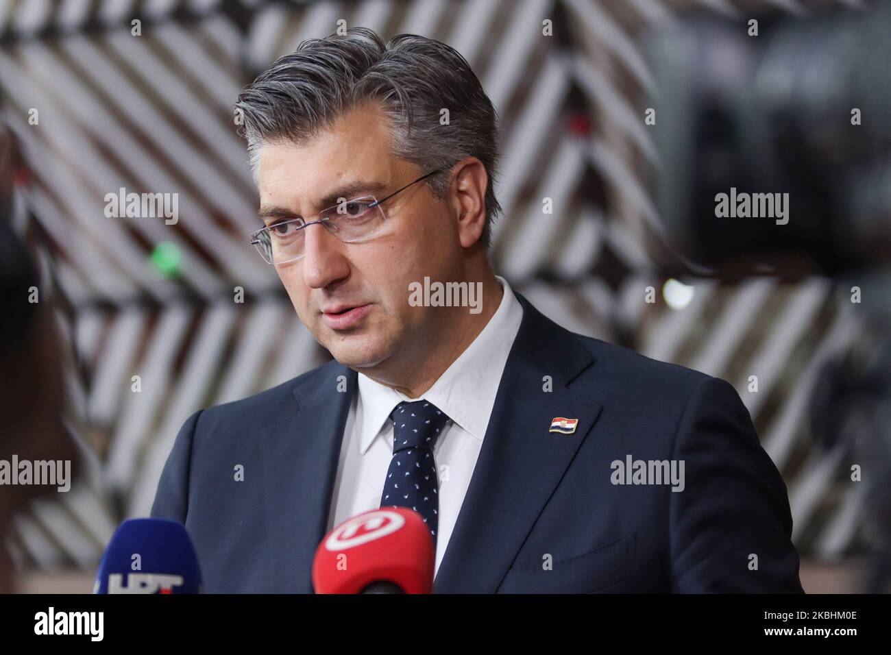 Prime Minister of Croatia Andrej Plenkovic as seen arriving on the red carpet with EU flags at forum Europa building. The Croatian PM is having a doorstep press and media briefing during the second day of the special European Council, EURO leaders summit - meeting about for the negotiations of the future planning of the next long term budget, financial framework of the European Union for 2021-2027. Brussels, Belgium, February 21, 2020 (Photo by Nicolas Economou/NurPhoto) Stock Photo