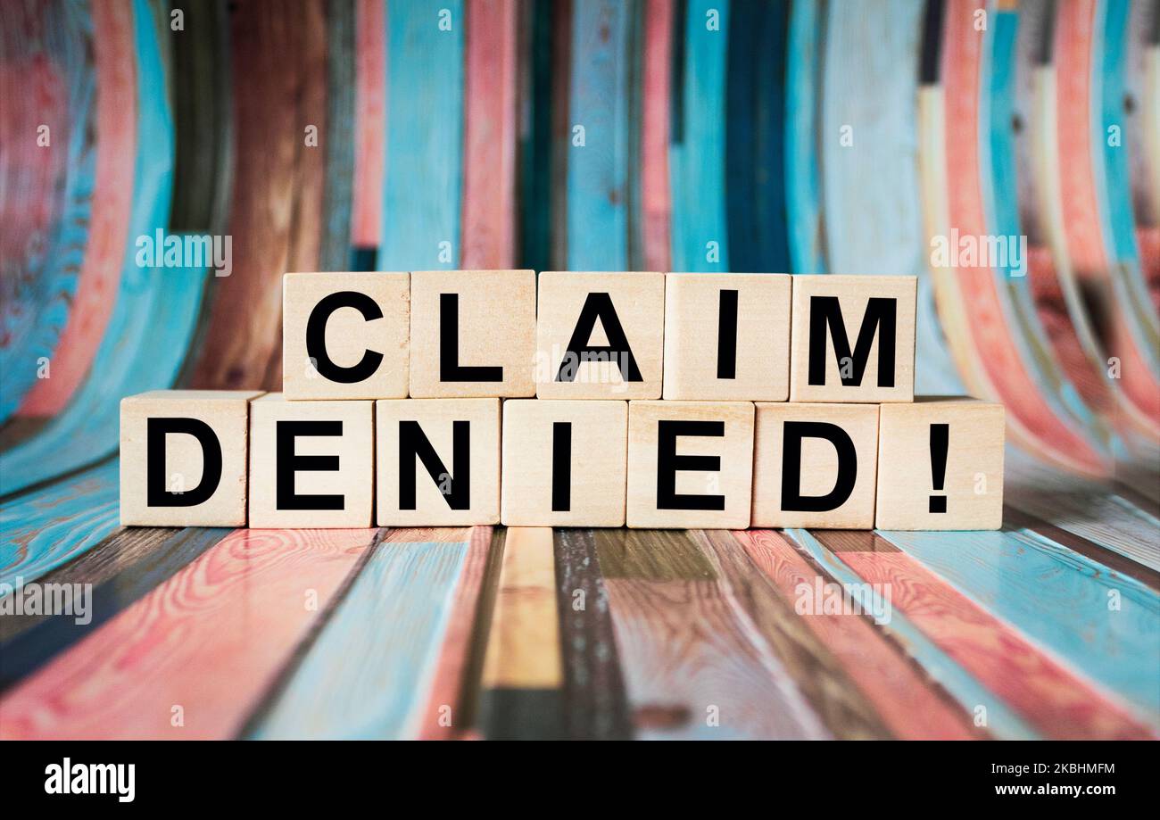 Wooden blocks with the text Claim denied. Insurance business concept. Stock Photo