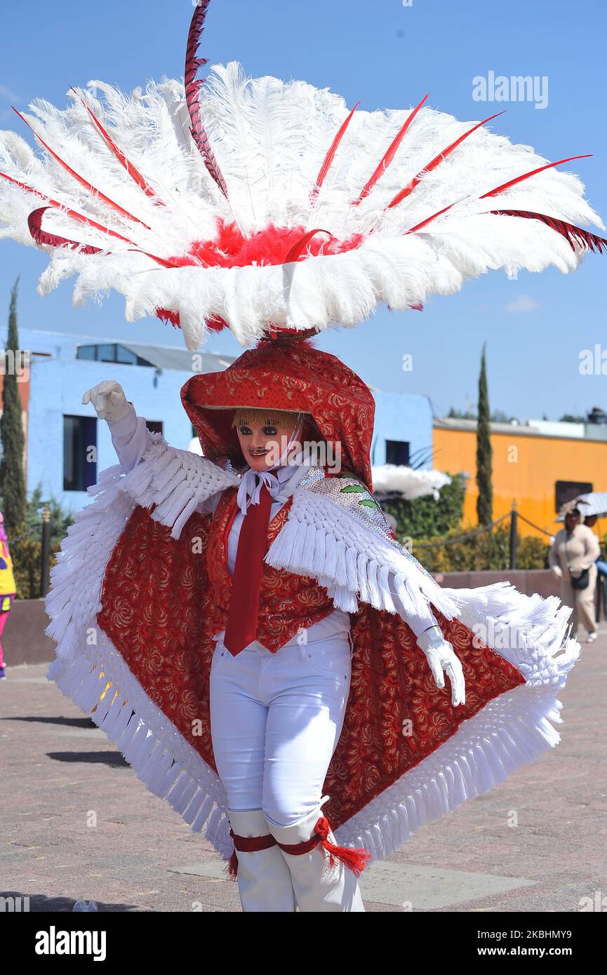 Dancers called Huehues take part during the traditional Carnival of
