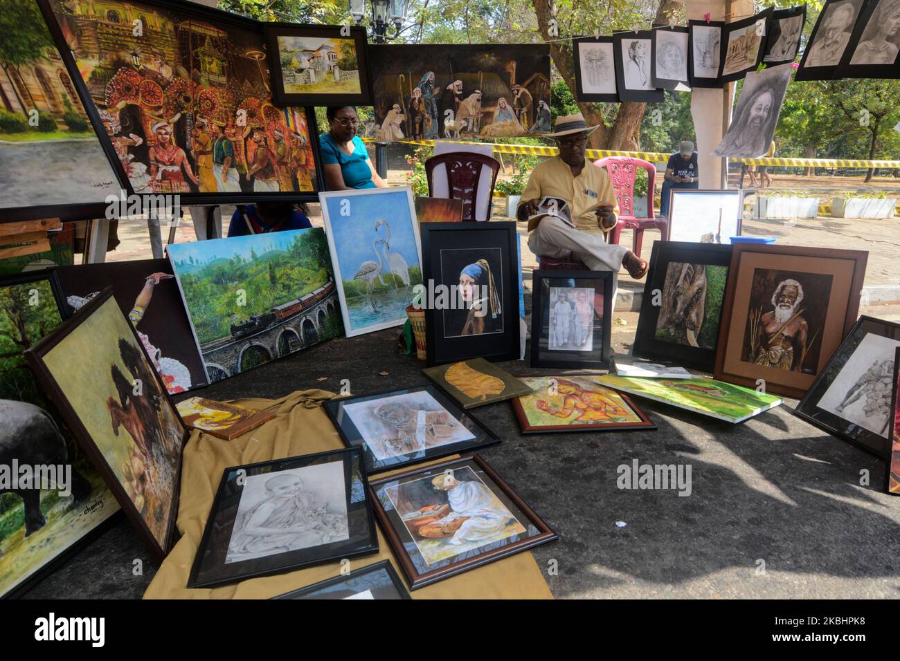 A Sri Lankan artist displays his artwork at the annual 'Kala Pola' Art