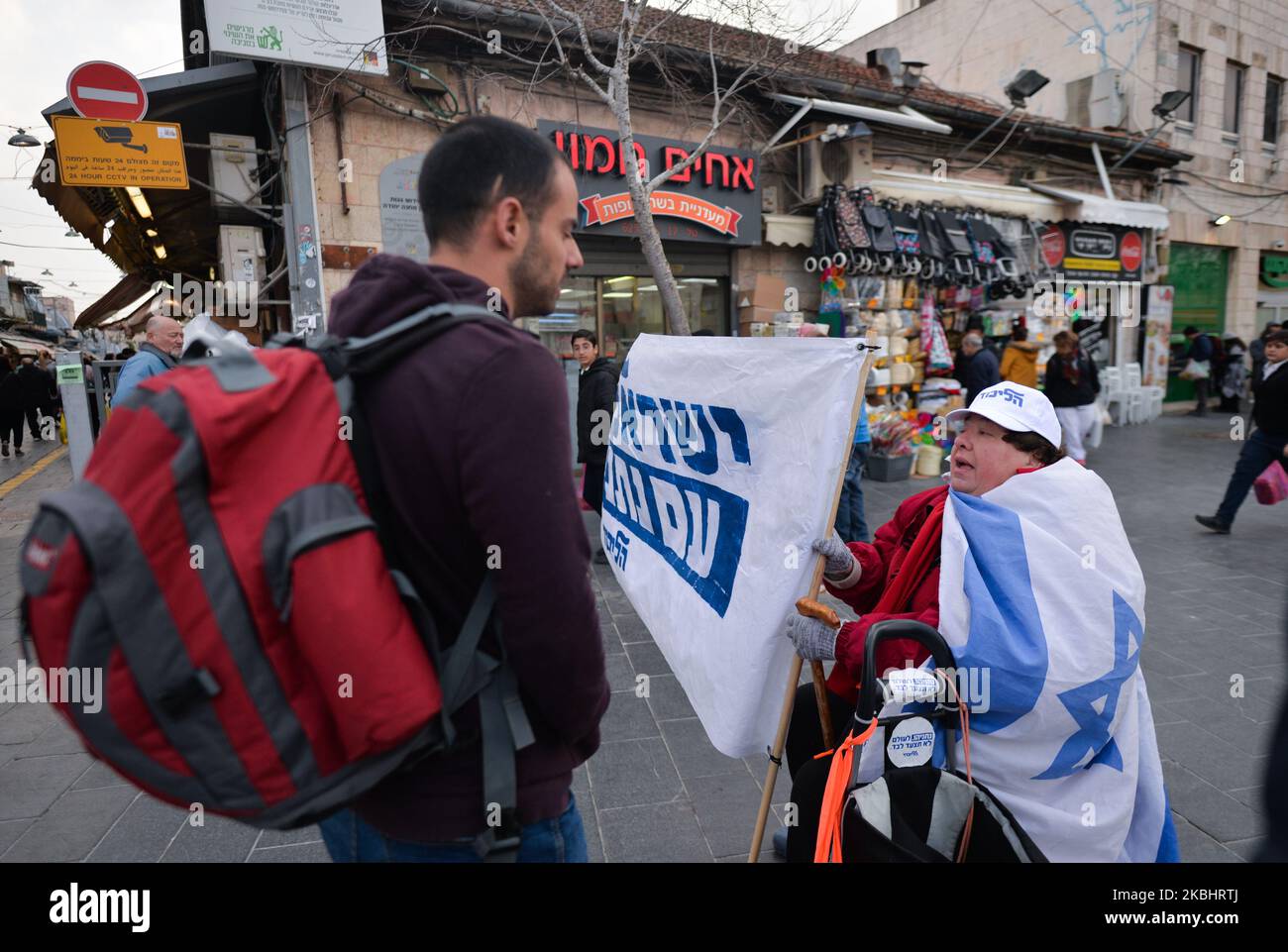 Likud political party campaigner seen near the entrance to Mahane Yehuda market. Israelis head to the polls for the third election in less than a year on March 2nd. On Monday, February 24, 2020, in Jerusalem, Israel. (Photo by Artur Widak/NurPhoto) Stock Photo