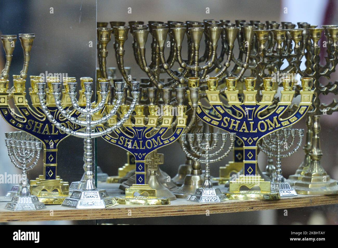 Different sizes of the menorah on display in a souvenir shop in Jerusalem. The seven-branched menorah was used in the ancient Temple or as a symbol. On Monday, February 24, 2020, in Jerusalem, Israel. (Photo by Artur Widak/NurPhoto) Stock Photo