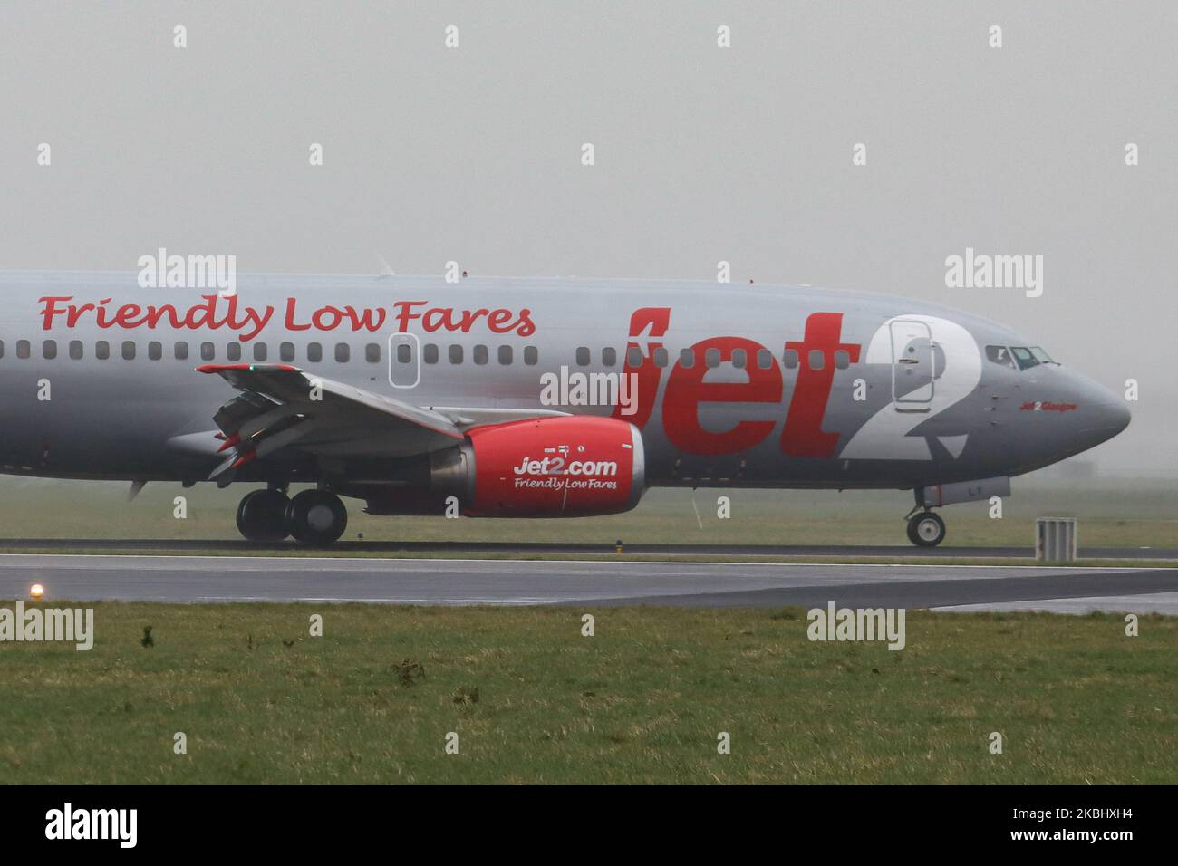 Jet2 Boeing 737-300 (QC) aircraft as seen landing during weather with fog, mist and a storm at Amsterdam Schiphol AMS EHAM International Airport on February 24, 2020. The airplane is a Classic Boeing 737-300 QC that means Quick Change from passenger to cargo / freight one. The airplane has 2x CFMI jet engines, registration G-CELY and is named Jet2 Glasgow. Jet2.com LS EXS CHANNEX is a British low-cost leisure airline carrier offering scheduled and charter flights, based with headquarters at Leeds Bradford airport. (Photo by Nicolas Economou/NurPhoto) Stock Photo