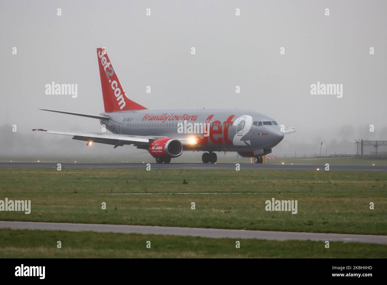 Jet2 Boeing 737-300 (QC) aircraft as seen landing during weather with fog, mist and a storm at Amsterdam Schiphol AMS EHAM International Airport on February 24, 2020. The airplane is a Classic Boeing 737-300 QC that means Quick Change from passenger to cargo / freight one. The airplane has 2x CFMI jet engines, registration G-CELY and is named Jet2 Glasgow. Jet2.com LS EXS CHANNEX is a British low-cost leisure airline carrier offering scheduled and charter flights, based with headquarters at Leeds Bradford airport. (Photo by Nicolas Economou/NurPhoto) Stock Photo