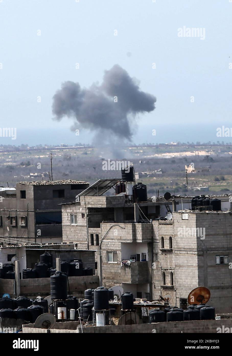 A picture taken on February 26, 2020 from Rafah in the southern Gaza Strip shows smoke billowing following an explosion close to the border on the Egyptian side of the divided city. (Photo by Abed Rahim Khatib/NurPhoto) Stock Photo