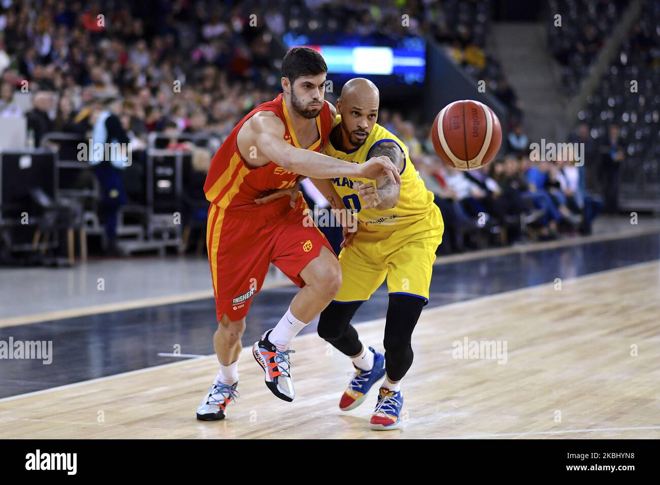 Santi Yusta of Spain in action against Kristopher Richard of Romania during the FIBA EuroBasket Qualifiers Group Phase Group A match between Romania and Spain, in Cluj Napoca, Romania, on February 20, 2020. (Photo by Alex Nicodim/NurPhoto) Stock Photo