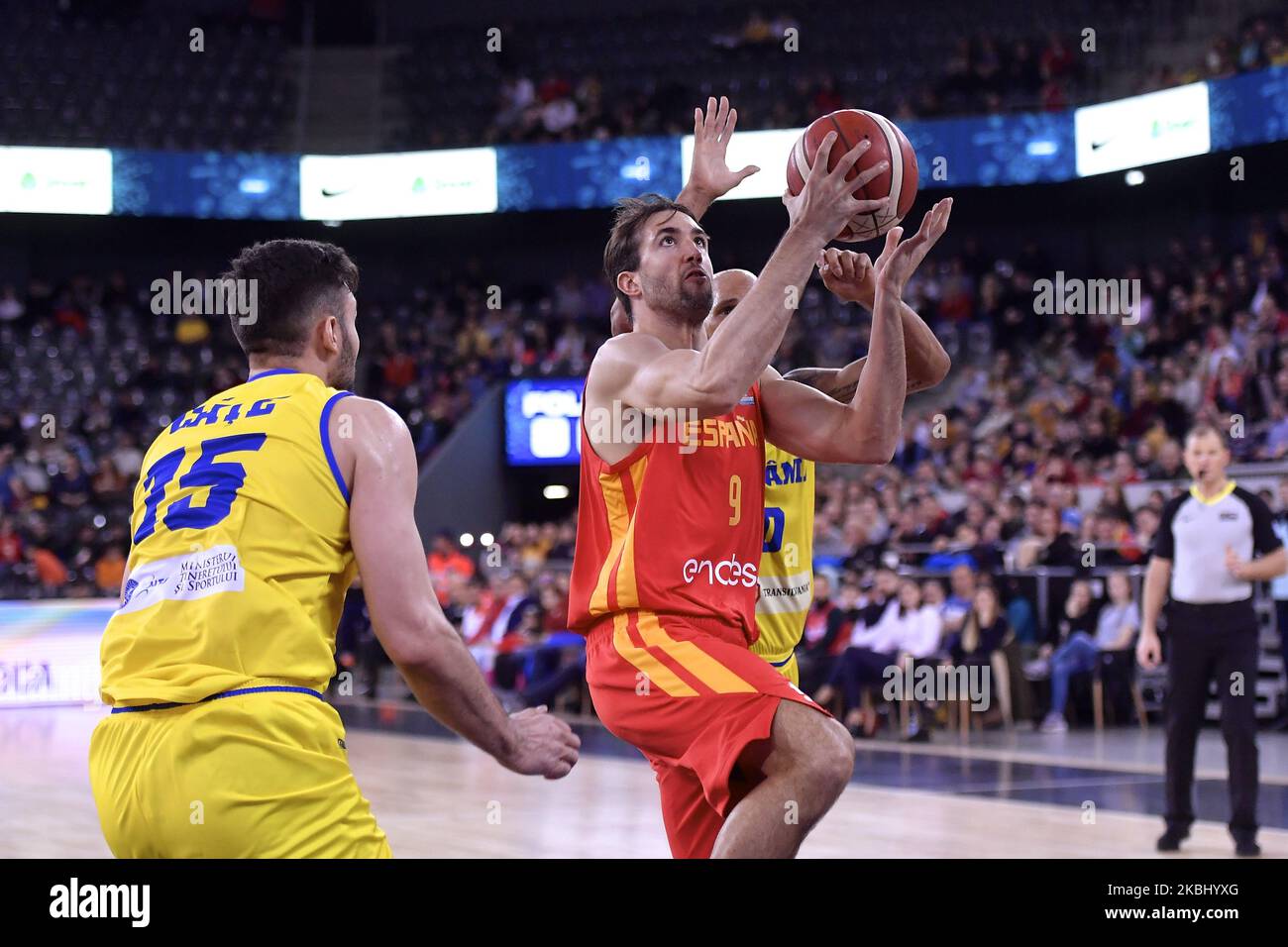 Nacho Llovet of Spain in action against Kristopher Richard and Emanuel Cate of Romania during the FIBA EuroBasket Qualifiers Group Phase Group A match between Romania and Spain, in Cluj Napoca, Romania, on February 20, 2020. (Photo by Alex Nicodim/NurPhoto) Stock Photo