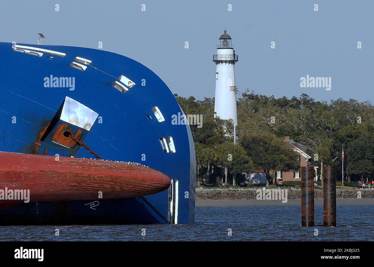 The Golden Ray cargo ship and the the St. Simons lighthouse are seen on