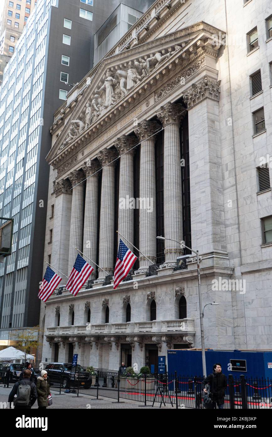 Exterior of New York Stock Exchange Building with classical architecture of Greece columns and US flags as seen during the day, NYSE Financial organization at Wall Street a symbol for the global and American Economy as one of the most powerful financial institute at lower Manhattan New York City, United States of America. February 2020, NY, USA (Photo by Nicolas Economou/NurPhoto) Stock Photo