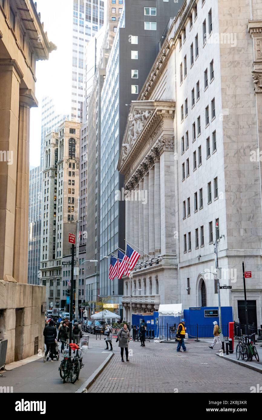 Exterior of New York Stock Exchange Building with classical architecture of Greece columns and US flags as seen during the day, NYSE Financial organization at Wall Street a symbol for the global and American Economy as one of the most powerful financial institute at lower Manhattan New York City, United States of America. February 2020, NY, USA (Photo by Nicolas Economou/NurPhoto) Stock Photo