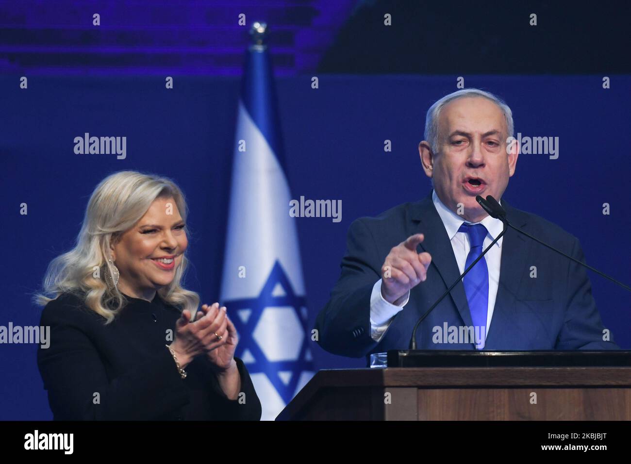 Israeli Prime Minister Benjamin Netanyahu stands next to his wife Sara as he speaks to supporters following the announcement of exit polls in Israel's election at his Likud party headquarters in Tel Aviv. On Tuesday, March 3, 2020, in Tel Aviv, Israel. (Photo by Artur Widak/NurPhoto) Stock Photo