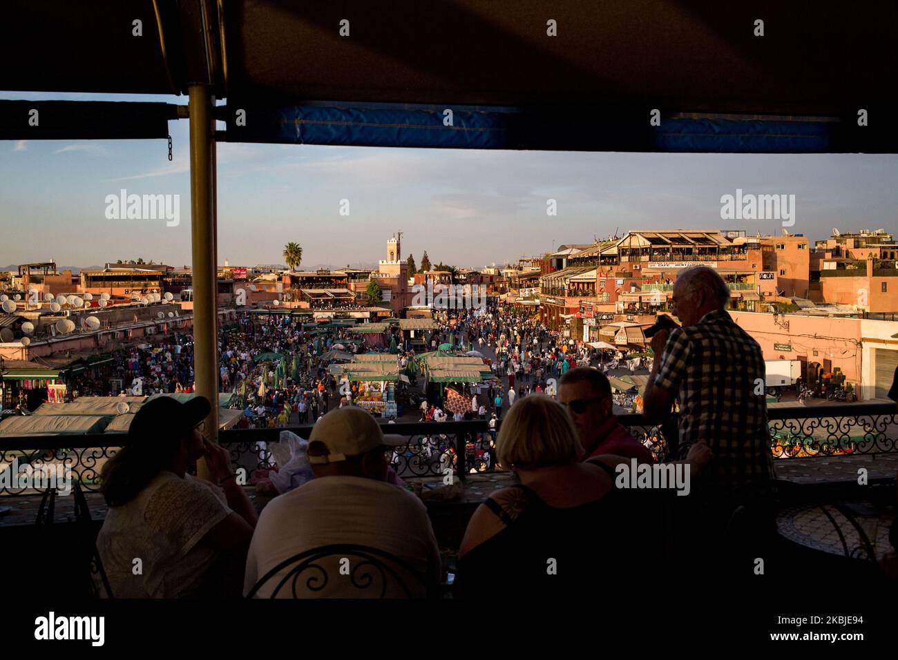 Marrakech, France, 19 October 2019. Tourists enjoy the view of Jemaa el-Fna square from the cafe de glacier during sunset. (Photo by Emeric Fohlen/NurPhoto) Stock Photo