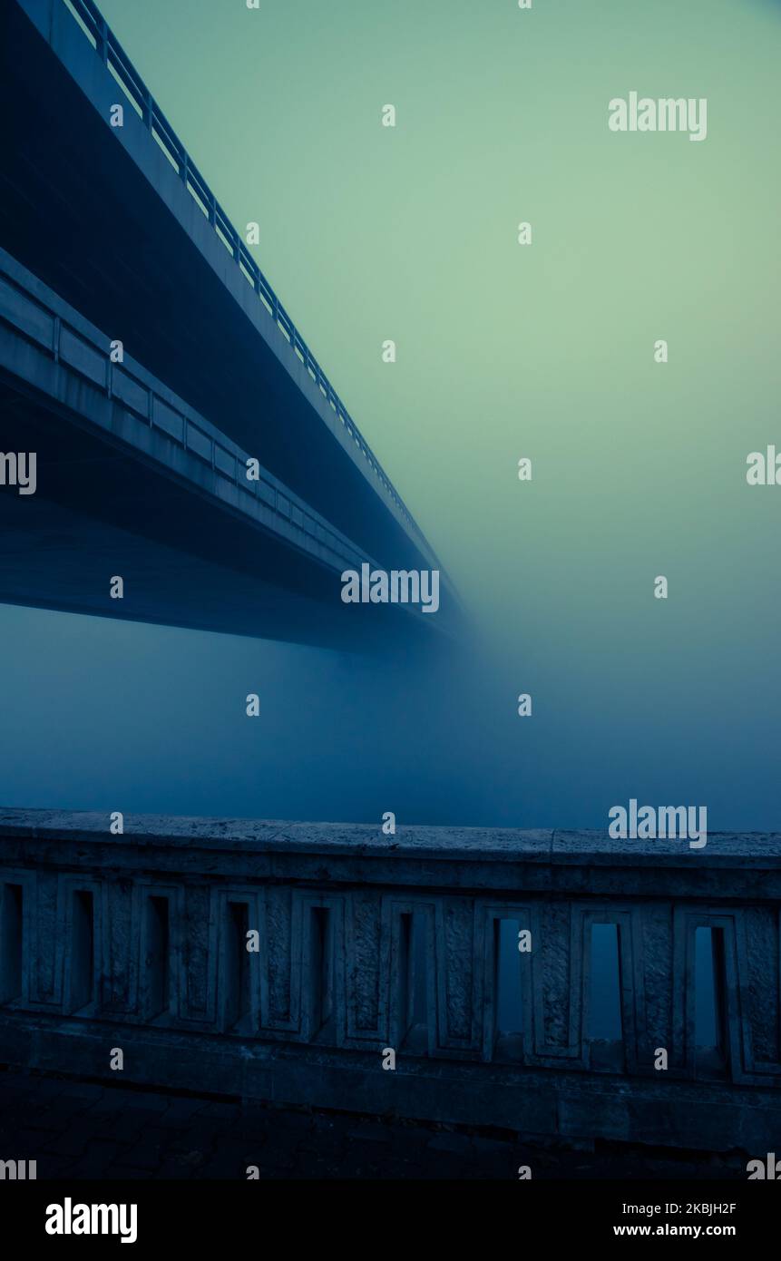 long bridge over water in fog Stock Photo Alamy