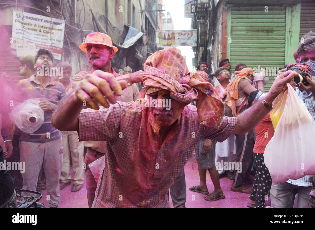 Devotees celebrate Holi festival in Kolkata, India, 08 March, 2020. The Hindu Festival of Holi, also known as festival of colours which symbolises the beginning of Spring season and worship Lord Krishna (A Hindu God). (Photo by Indranil Aditya/NurPhoto) Stock Photo