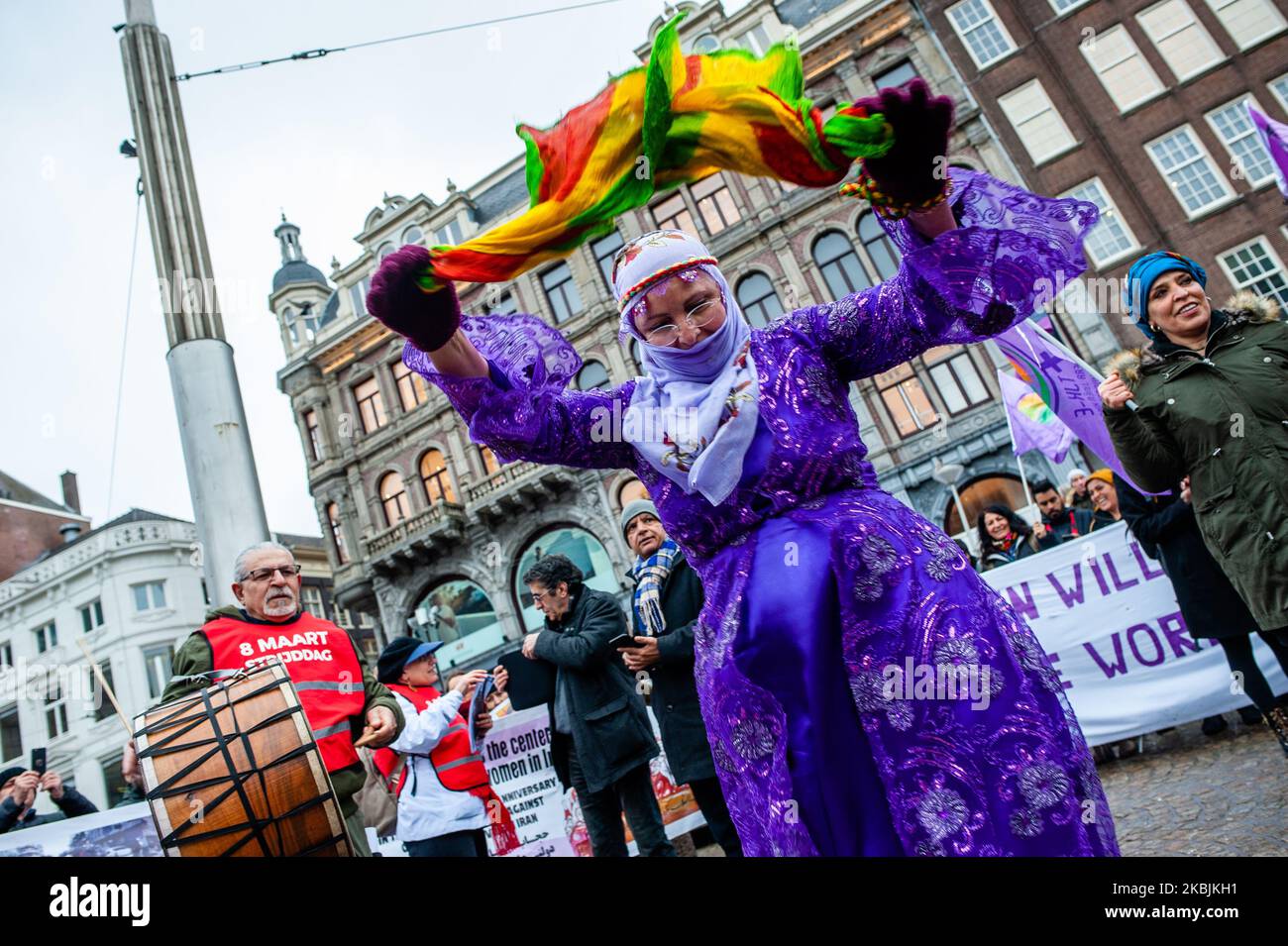 A Kurdish woman is seen dancing wearing traditional clothes from ...